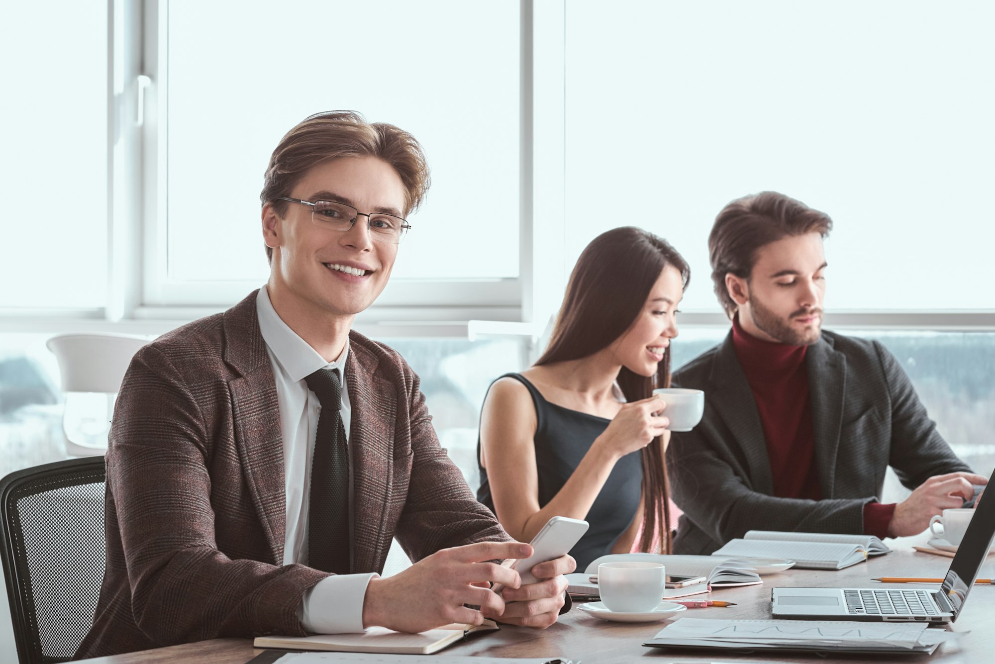 Businesspeople at office working together sitting man in eyeglas